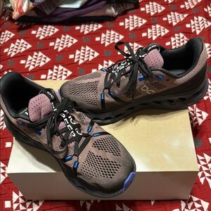 On Running Brown and Black Athletic Shoes